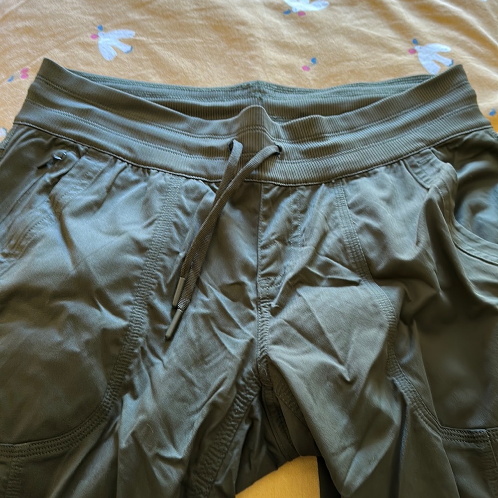 The North Face women’s olive green Medium hiking pants.